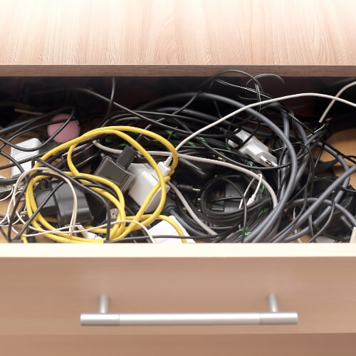 drawer full of old tangled cables