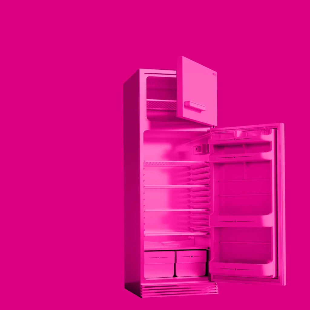 empty fridge with doors open in a pink haze pink against a bright pink backdrop